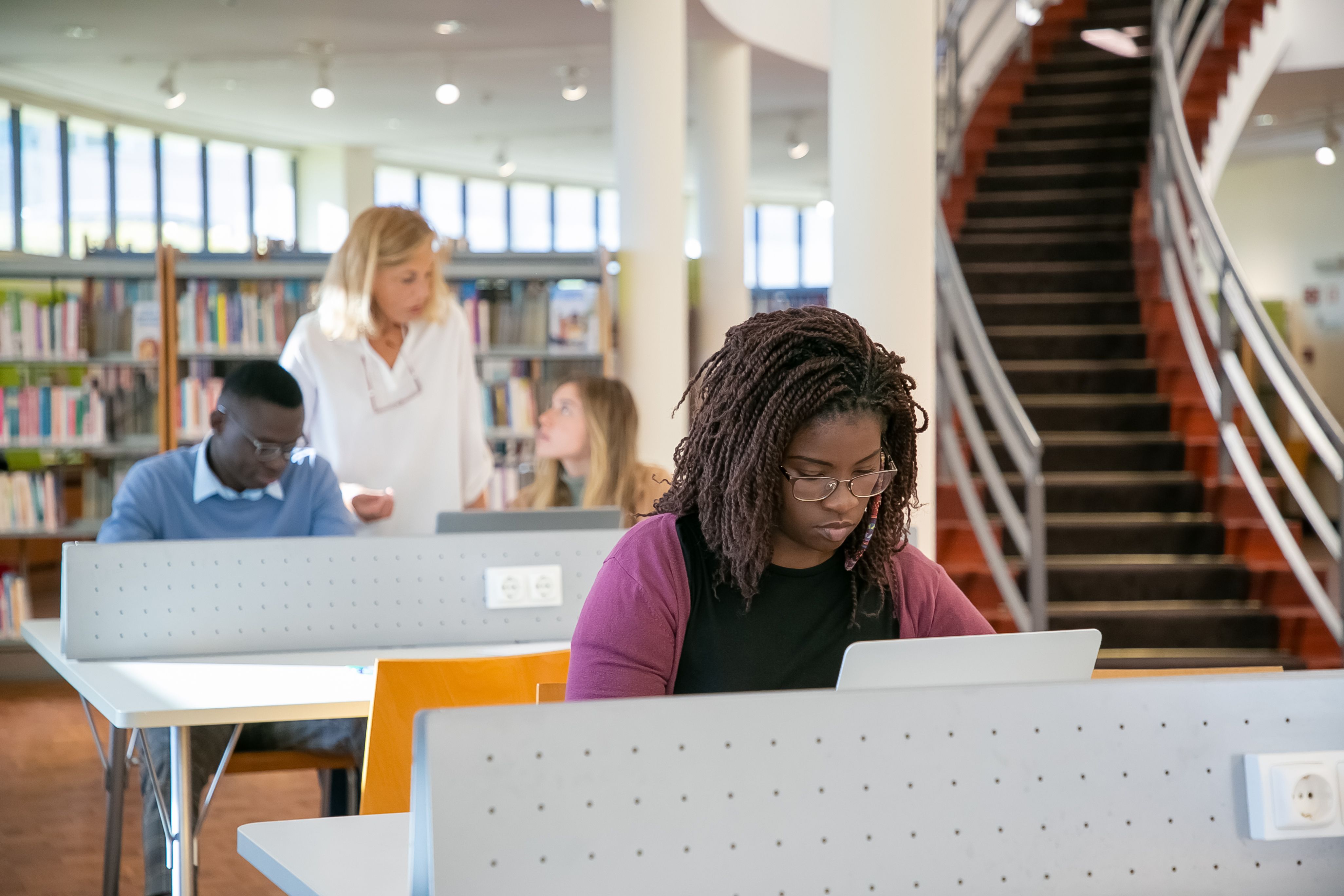 A diverse group of students learning AI and technology together